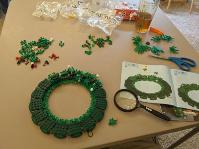 Each of the little leaves and berries went on in, what appeared to me to be, a random pattern. I had to use the magnifying glass to check the details.