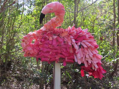 Flamingo made from painted, cut up pieces of water bottles. (He had rubber gloves for feet).