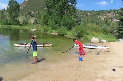 The 'Z' boys, Zane and Zeke, playing with the paddleboard paddles