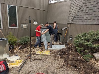 They must have standard-sized sections of concrete pad and use as many as they need for a particular unit. They didn't match up exactly with the old pad, but they met the need.