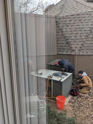 We took photos from the relative warmth of the house as the Edmond H&A workers dismantled the HVAC unit, bundled up in their cover-alls.