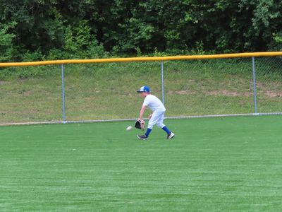 Sunday evening, after the movie, we took Max to baseball practice. He was moving too fast in the low light for us to get any clear photos, but here are a few of his fielding practice.