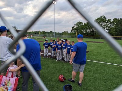 After the game, the coaches organized some group photos, that we watched from outside the ball field fence.