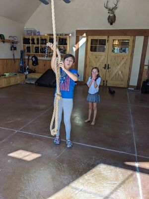 Devon, adjusting the rope for Claire's next swing