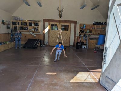 Grandma watched as Devon tried the swing on her own.