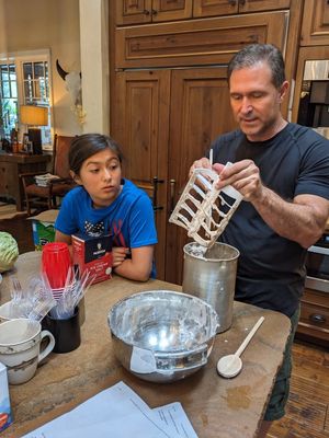 Devon watches as her Dad cleans the paddle from the first batch, Cookies and Cream.