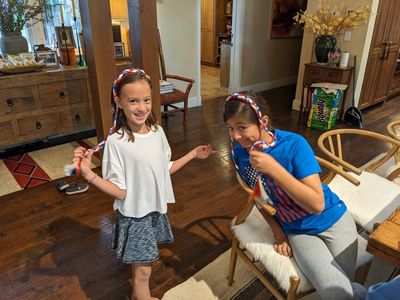 Claire and Devon, modeling their red, white and blue braids