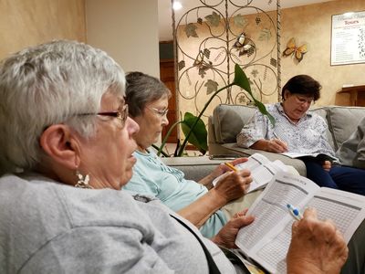 Ann and Carolyn, going over the daily checklist with the rest of the group, at Buena Vista Lodge, our last evening in Costa Rica, Feb 22, 2020