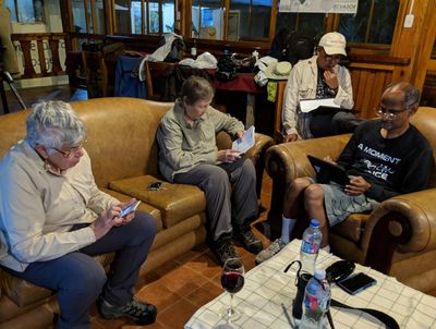Ann, Carolyn, Lelis and Kannan, reviewing checklists at the end of the day at Jorupe Lodge, Ecuador, Dec 19, 2018