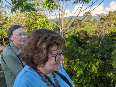 On an observation tower in southern Costa Rica: Carolyn and Mary (with a butterfly in her hair): Feb 21, 2020.