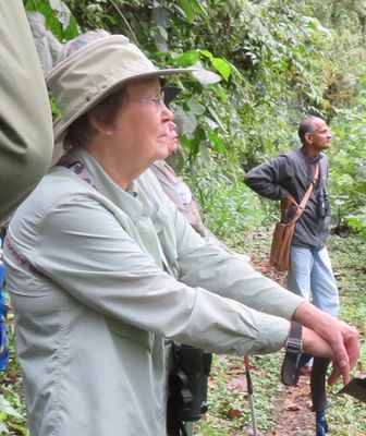 Carolyn, with Dr Kannan in the background, waiting to get a look at a parrot. Ecuador, Mar 19, 2018