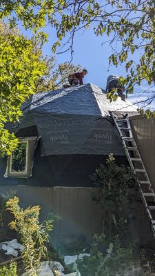 NW side of small dome
They put a layer of new tar paper along the bottom and self-adhering Tyvek over the top part of the dome. I couldn't tell that they were working from the bottom up with the Tyvek and assumed self-adhering meant it sealed itself. It appeared heavier than house wrap we used on the walls of the sunroom.
