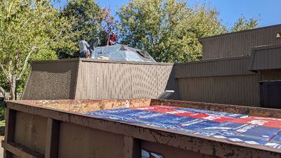 They put new tar paper, as well as Tyvek, around the small dome skylights.