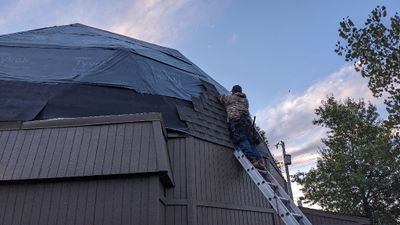 Day 2: The guys were back out early the next morning to start applying the new shingles.