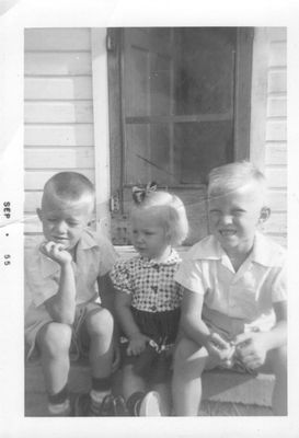 Gerald, Kathy and Steve on front porch of their house at 2713 SW 31st, OKC, where they all grew up. Probably 1956