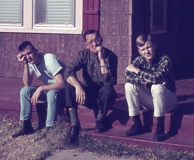 Gerald, Dad and Steve on the front porch on 31st St. Yes, we had red siding with pink trim. Dad was always getting leftover stuff from jobs, or a good deal on supplies because of job connections, and I guess red was cheap. I also think the siding was made with asbestos.