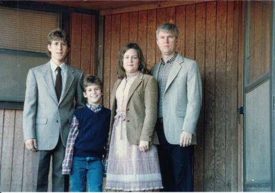 All dressed up for church, standing on the old front porch: Jeremy, Seth, Mary and Steve