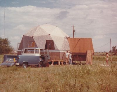 With the old doorway closed off, Mary watched as Steve and his Dad started putting metal flashing around the bottom edge of the dome before starting to put on shingles.