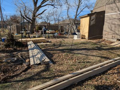 When I finally braved the cold to get a few photos, they had already started installing the T1-11 siding on the SW side of the garage.