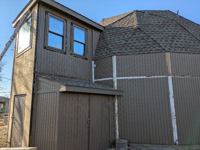 They also removed the old trim from the SE side of the house, in preparation for installing new panels and trim.