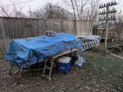 We knew it was snow was forecasted for the next two days, so I offered a couple of old tarps I had, so they could cover the materials.
