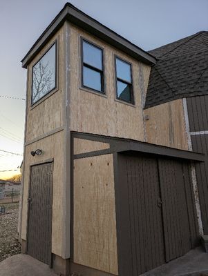 With all the caulking they did on the S and W side of the house, they made less headway on installing new panels, but did get the window room finished.