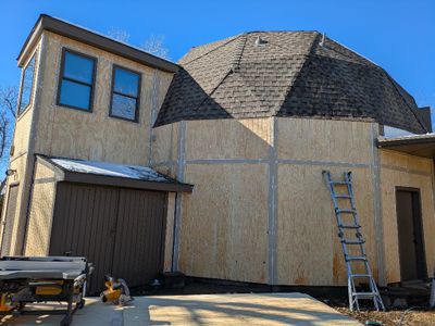 E side of big dome with trim and caulking almost completed
