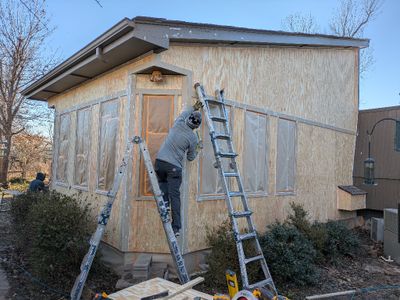 Finishing the caulking on the N side of the sunroom