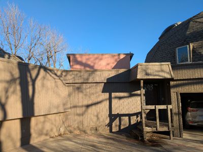 The extend wall that makes the W side of the sunroom