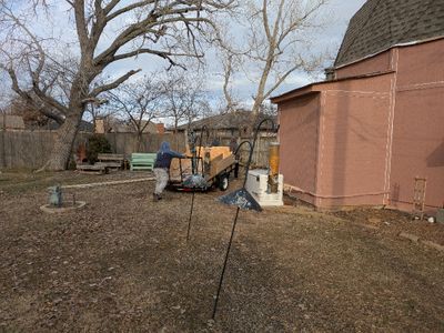 Moving their trailer to collect all the old trim and other debris from the job