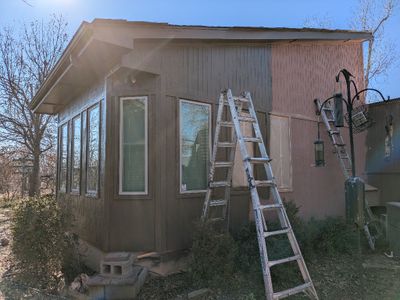 Finishing the N side of the sunroom, removing masking from the windows as they went