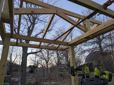 Looking up and W from under the bench roof
After getting the 10'x2x4 board I needed for the last 2 rafters, I cut them out and installed the rafters on the W side of the roof structure.