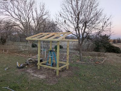 I attached each rafter at the outer edge with a single screw, then at the top with 2 screws through the back of the ridge board.