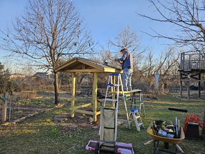 Mary caught me putting on shingles.