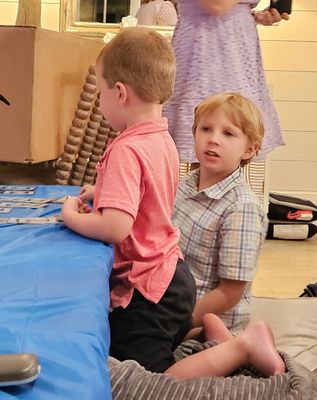 Xander and Carson relaxed with a card game.
