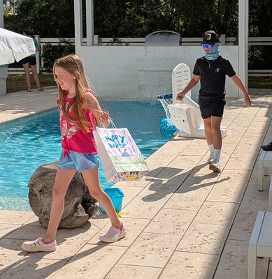 Alexa and Max check the pool area.