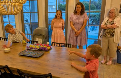 Back at the house, Angela provided the evening's entertainment. Continuing the egg theme of the day, everyone tried bouncing a ping pong ball into a baking tray to win a prize-filled egg.
Carson, Madison, Jenny, Xander, Mary
