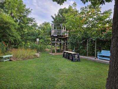 Mary took some photos of my setting up to work after buying another load of lumber. We had an electrical outlet installed at the S end of the big trellis a few years ago, so I was able to use my circular saw closer to the work site.