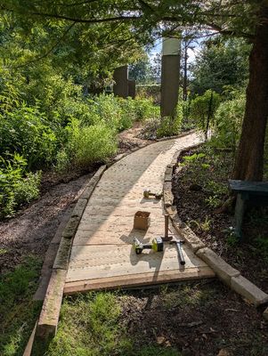 Looking W from the E end. I will move more flower bed border rocks on the left (out of sight in this photo) to expand the back fence bed as it extends to the gate in the SE corner of the yard and fence.