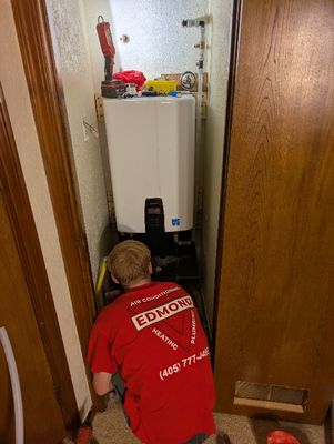 Trent, checking connections
They installed a pressure valve (upper right, above heater cabinet) that will compensate for any water pressure changes coming in from the connection to the city water supply to prevent damage to the unit.