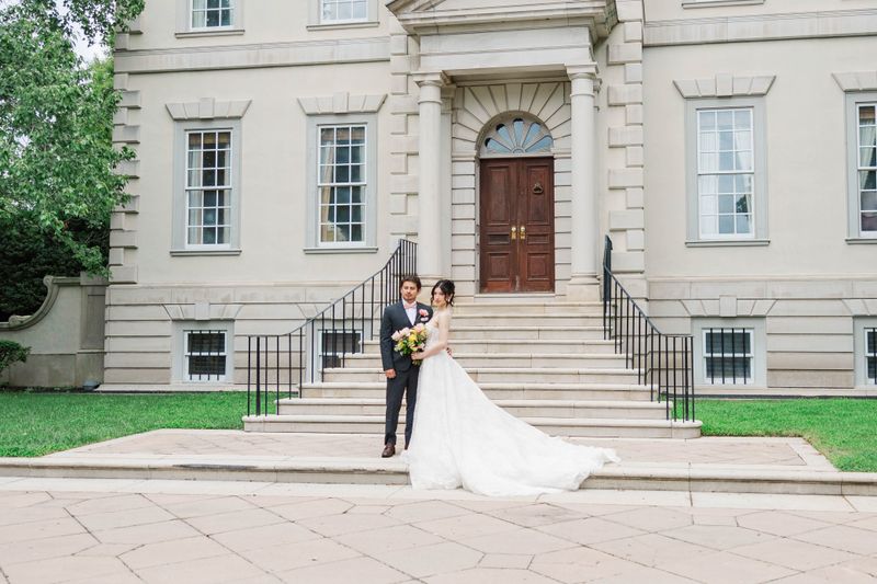 Bride and Groom in front of Estate