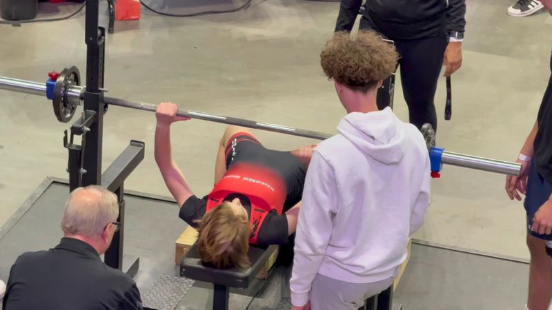 Kristina prepares to bench press