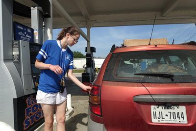 Helen Getting Gas