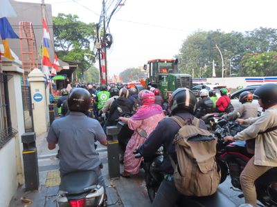 Jakarta motorbikes on footpath in morning rush hour