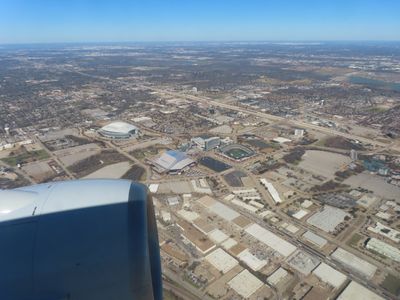 American Airlines arriving Dallas above AT & T Stadium and Globe Life Field