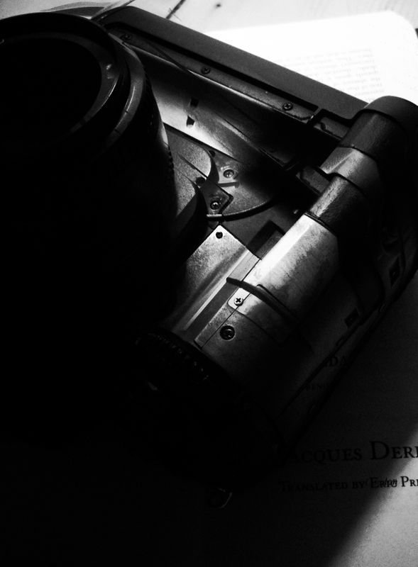 Nikon D1X on top of Archive Fever by Jacques Derrida