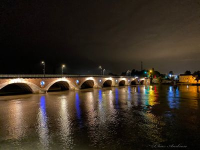 Libourne Arch Bridge over the Dordogne River at night