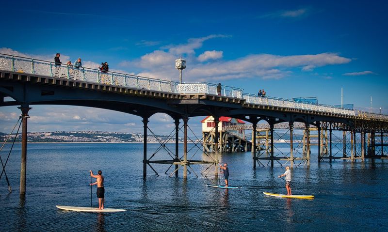 Under the pier.