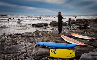 Surfers at Rest Bay, Porthcawl.