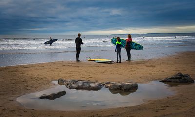 Surfers at Rest Bay, Porthcawl.